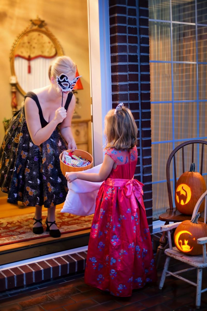 Photo of a young girl trick-or-treating.
